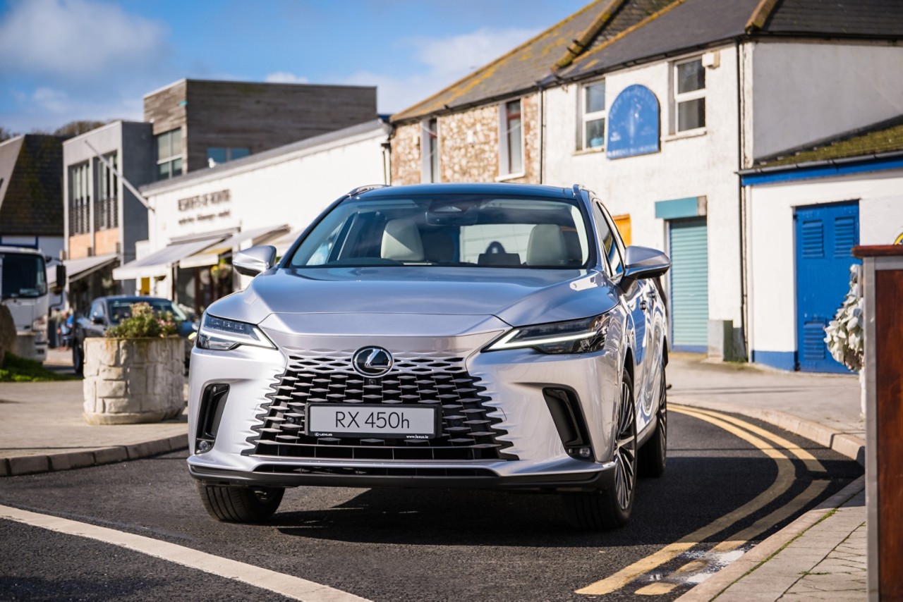 Lexus RX 450h driving in a town