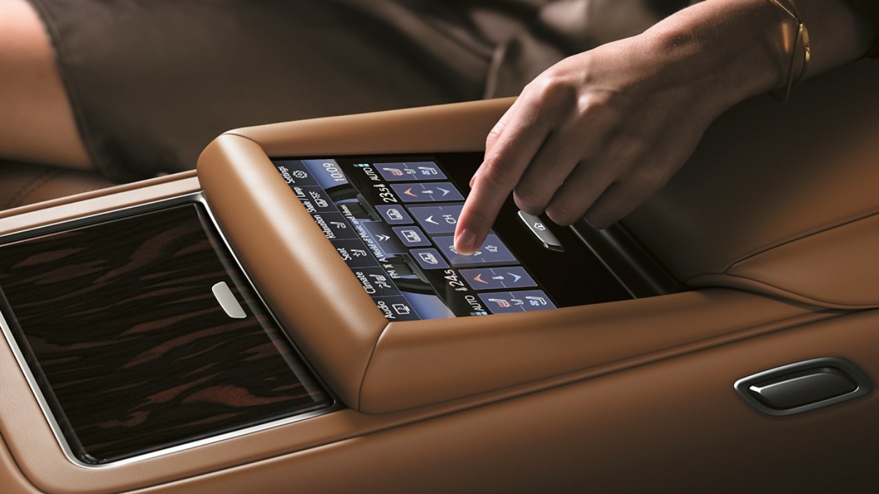 hand touching a Lexus touchpad screen