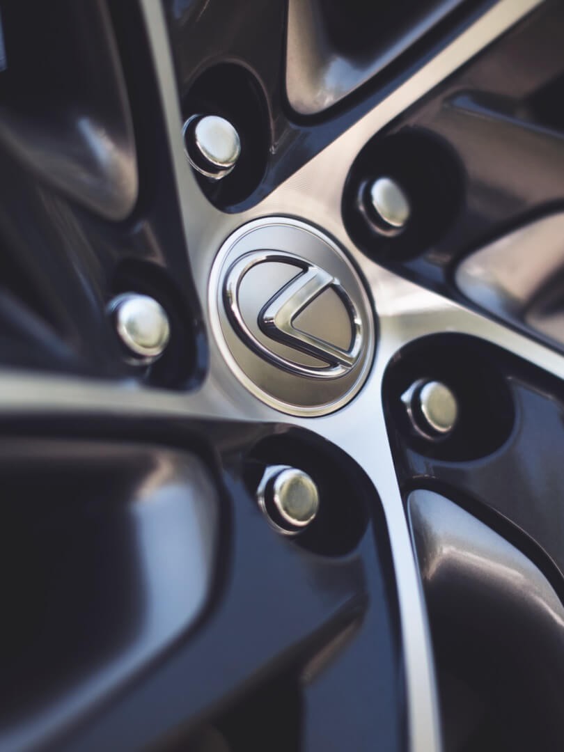 close up of lexus logo on wheel