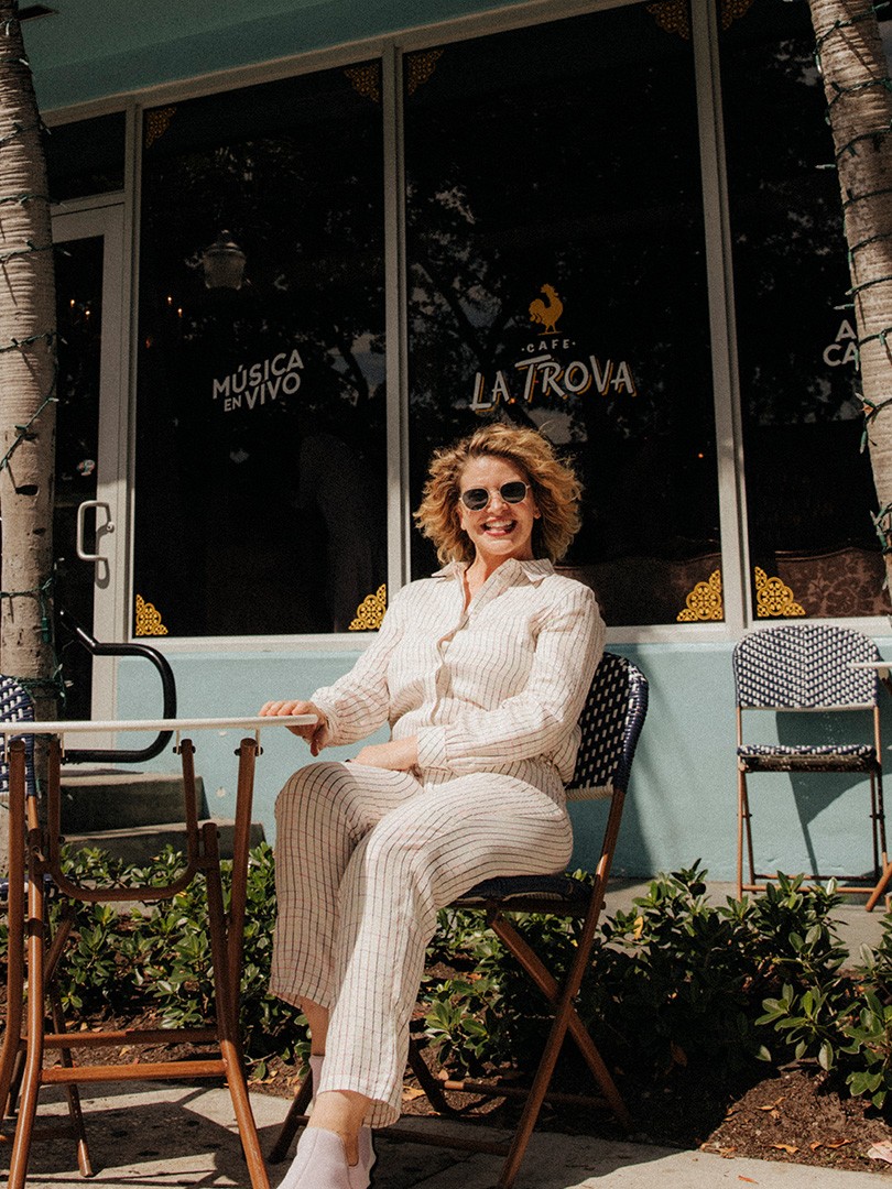 Michelle Bernstein sitting in a chair